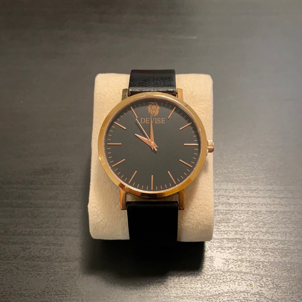 Devise Gold & Black leather strap watch.